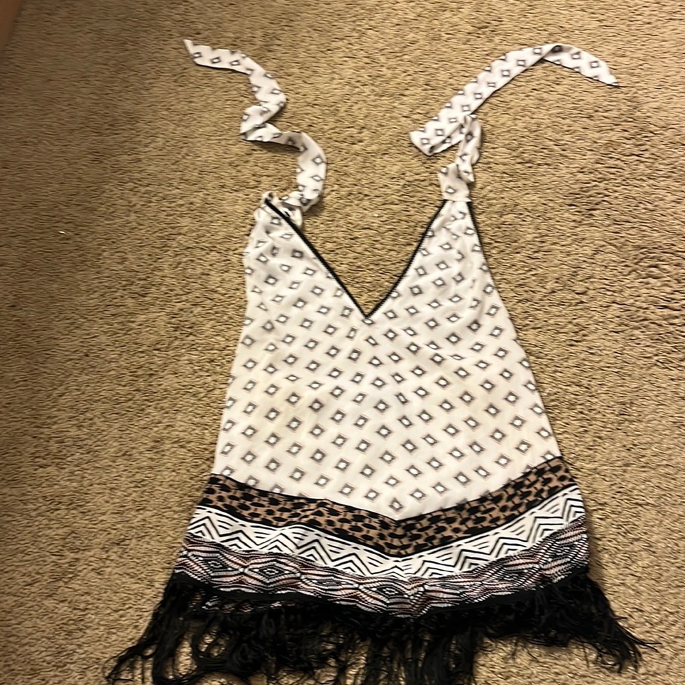 100% polyester , lining 100% polyester , and fringe 100% polyester